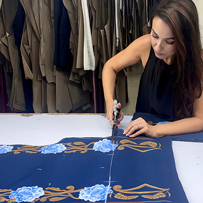THE WOMAN BEHIND THE BRAND